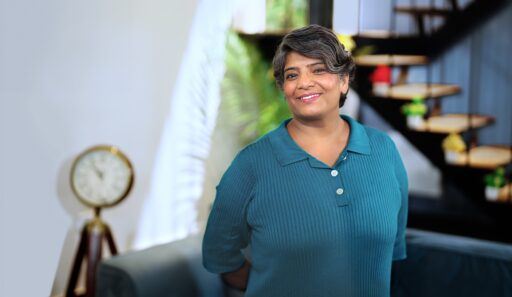 Happy lady at home by stairs